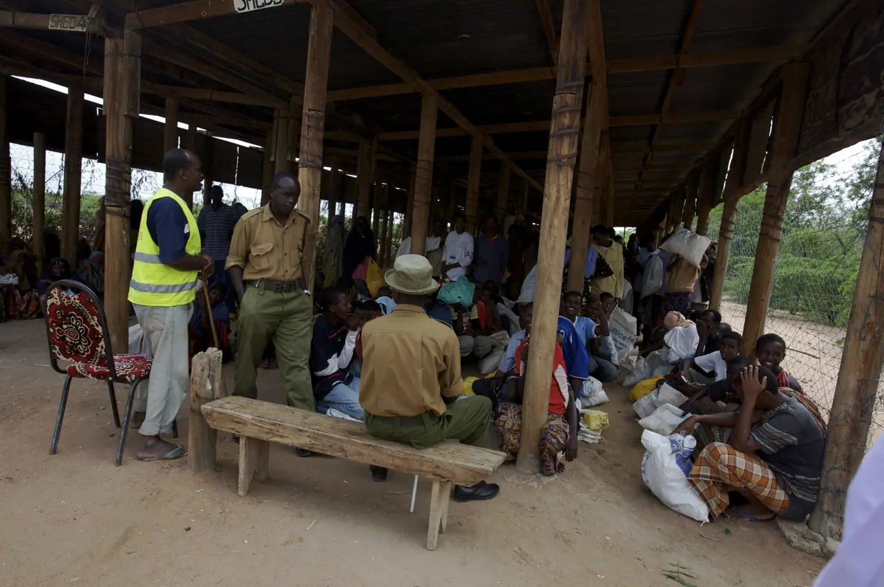 Volunteers distributing relief supplies after a flood in East Africa