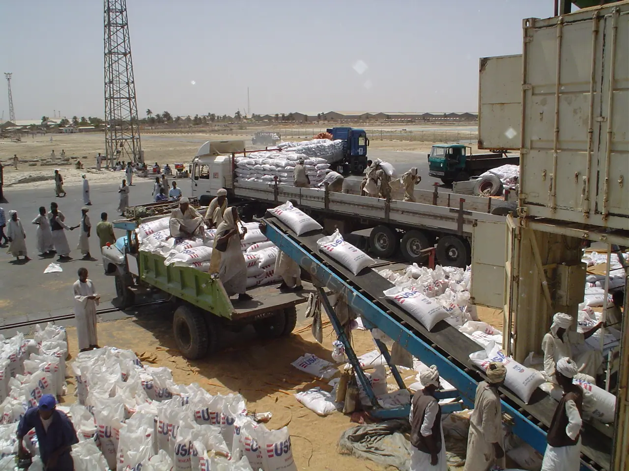 Photo: USAID · Public domain Caption: Complex logistics for food aid to Darfur – The provision of food commodities, delivery to the country in need,